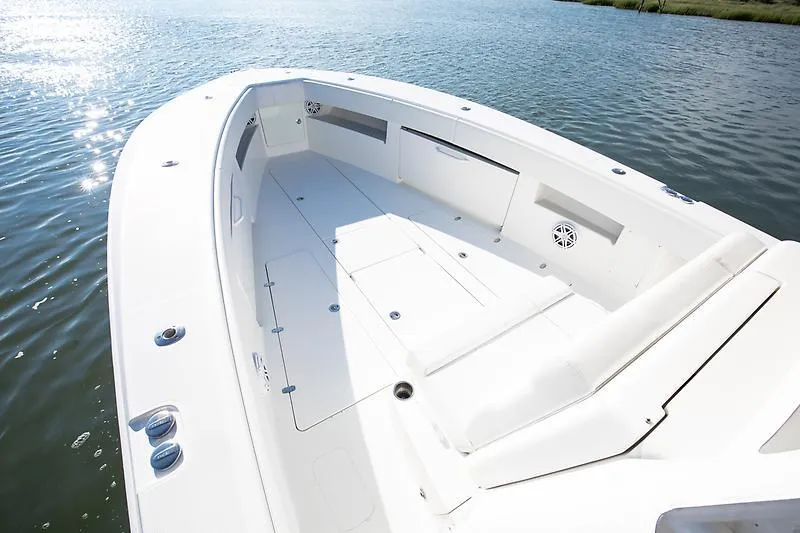 Slide: The Image of 2017 SeaVee 390OZ boat deck, spacious and sleek design on calm water. - 4