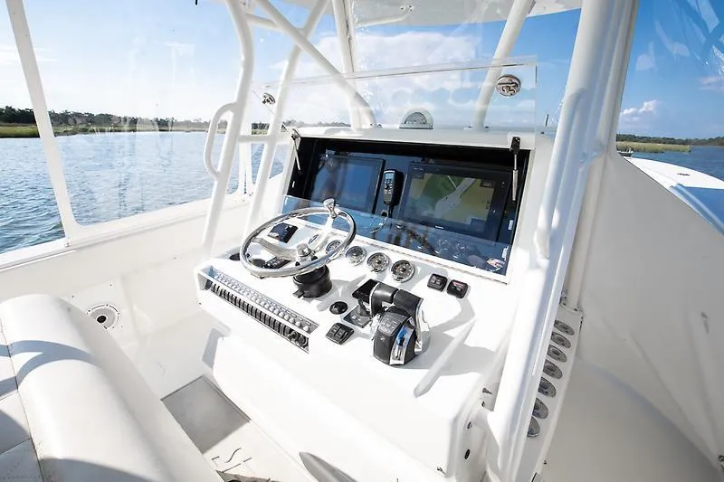 Slide: The Image of 2017 SeaVee 390OZ boat helm with modern navigation and control systems. - 7