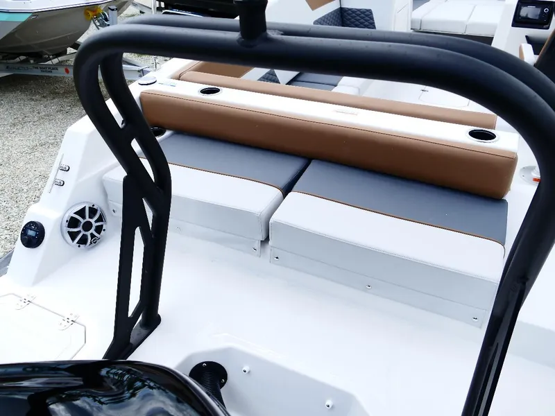 Slide: The Image of 2026 Starcraft SVX 231 OB boat interior with cushioned seating and cup holders. - 12