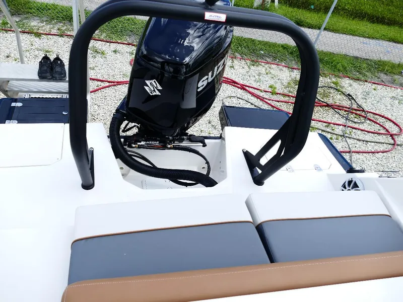 Slide: The Image of 2026 Starcraft SVX 231 OB boat with Suzuki outboard motor and cushioned seating. - 14