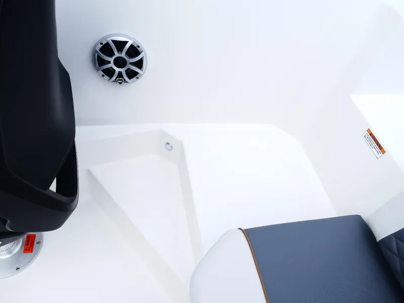 Slide: The Image of 2026 Starcraft SVX 231 OB boat interior with speaker and seating detail. - 16