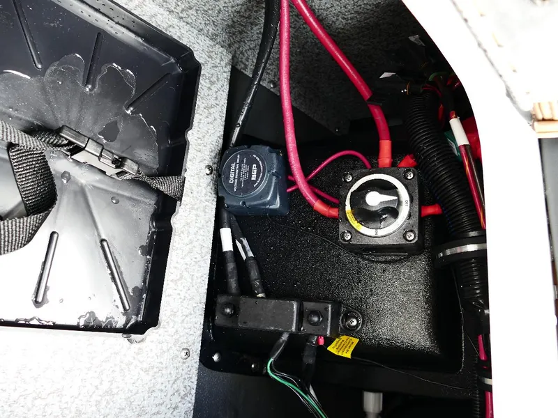 Slide: The Image of Electrical components inside a 2026 Starcraft SVX 231 OB boat, featuring wiring and switches. - 17