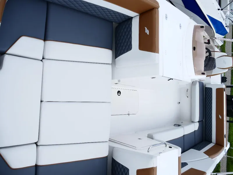 Slide: The Image of 2026 Starcraft SVX 231 OB boat interior with cushioned seating and modern design. - 26