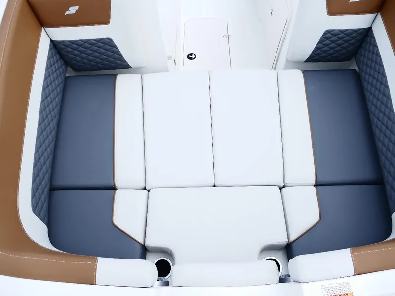 Slide: The Image of 2026 Starcraft SVX 231 OB boat interior with cushioned seating and quilted accents. - 27