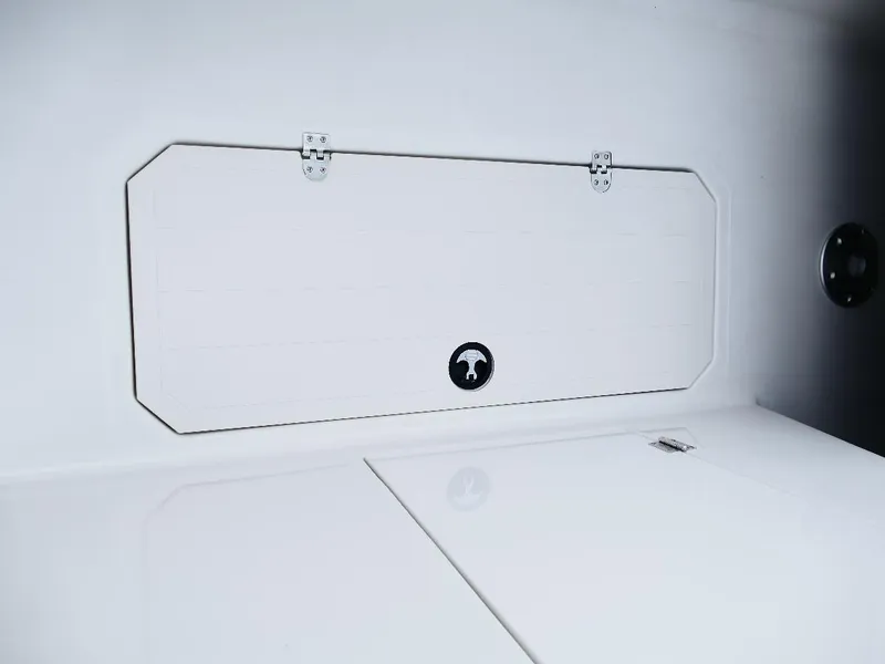 Slide: The Image of 2026 Starcraft SVX 231 OB boat storage compartment with sleek white finish. - 35
