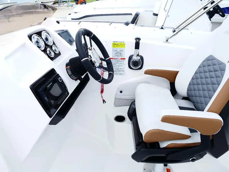 Slide: The Image of 2026 Starcraft SVX 231 OB boat cockpit with modern steering and controls. - 39