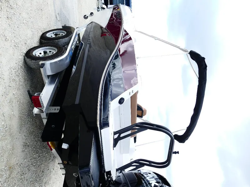 Slide: The Image of 2026 Starcraft SVX 231 OB boat on trailer, rear view, outdoors. - 48