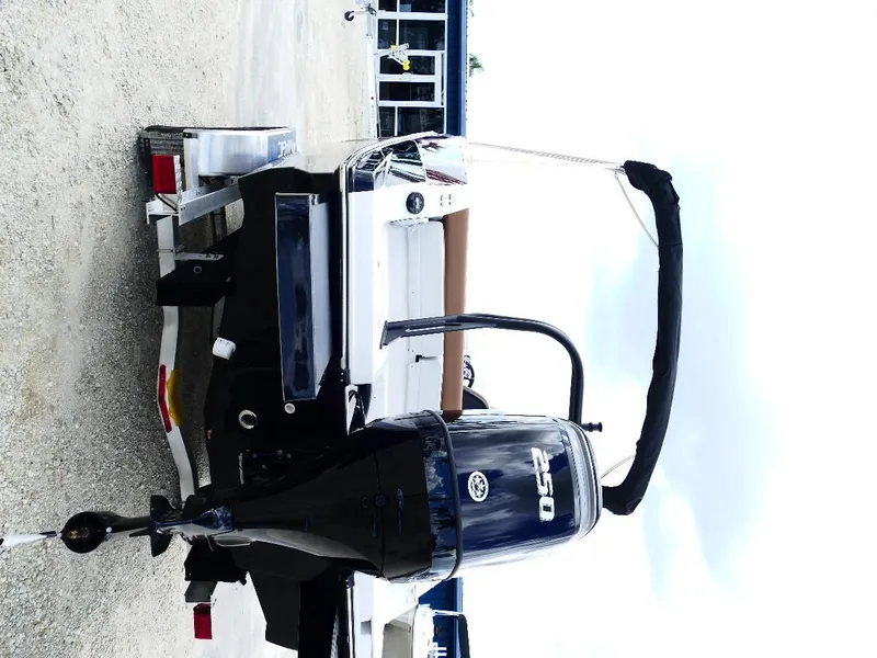 Slide: The Image of 2026 Starcraft SVX 231 OB boat on trailer, rear view with outboard motor. - 49