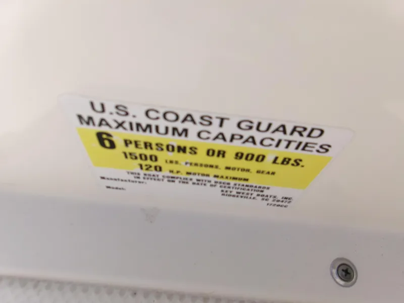 Slide: The Image of U.S. Coast Guard capacity label on 2016 Key West 1720 Center Console boat. - 11