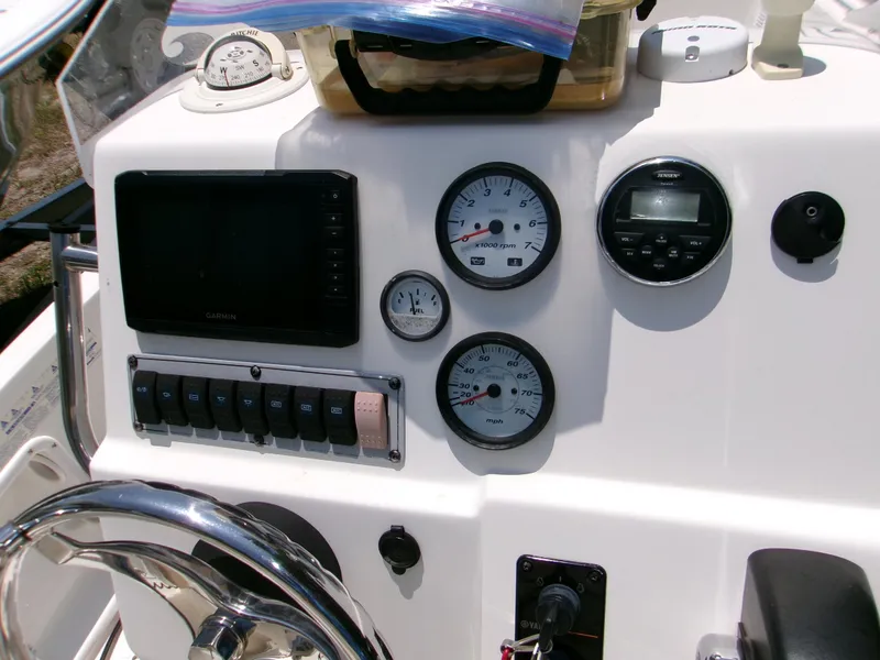 Slide: The Image of 2016 Key West 1720 Center Console dashboard with gauges and controls. - 12