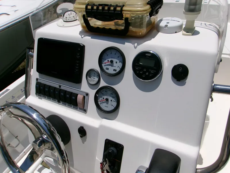 Slide: The Image of Center console of 2016 Key West 1720 boat with gauges and controls. - 6