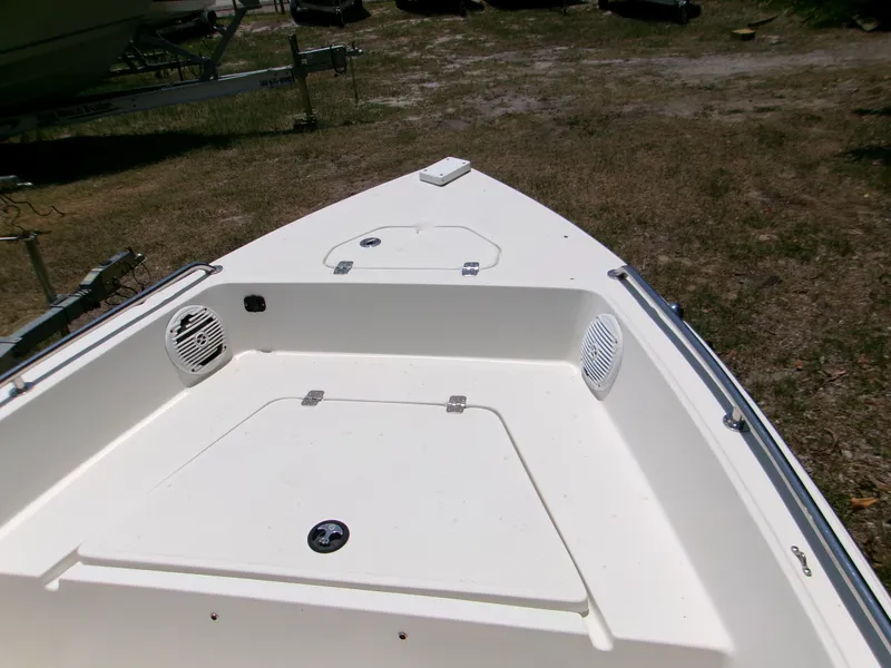 Slide: The Image of 2016 Key West 1720 Center Console boat, front deck view with storage compartments. - 7