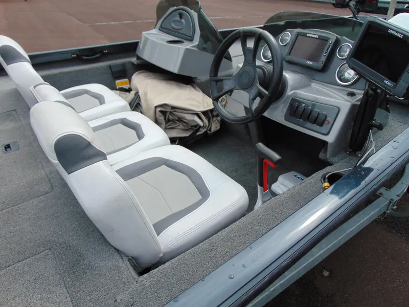 Slide: The Image of 2014 Crestliner VT 19 boat interior with steering wheel, seats, and control panel. - 7
