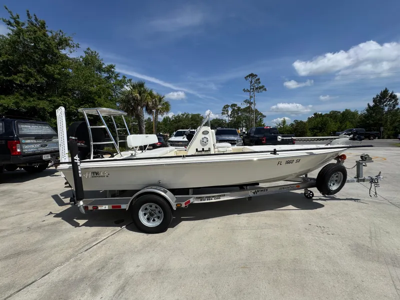 Slide: The Image of 2021 Hewes Redfisher 18 boat on trailer in sunny outdoor setting. - 10