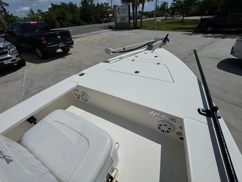 Slide: The Image of 2021 Hewes Redfisher 18 boat in parking lot, featuring sleek design and modern equipment. - 21