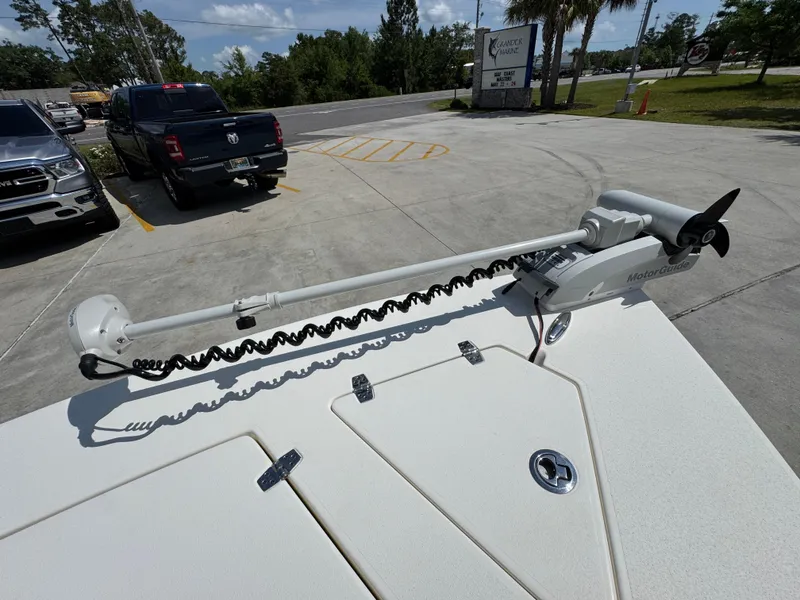 Slide: The Image of 2021 Hewes Redfisher 18 boat with trolling motor in parking lot. - 23