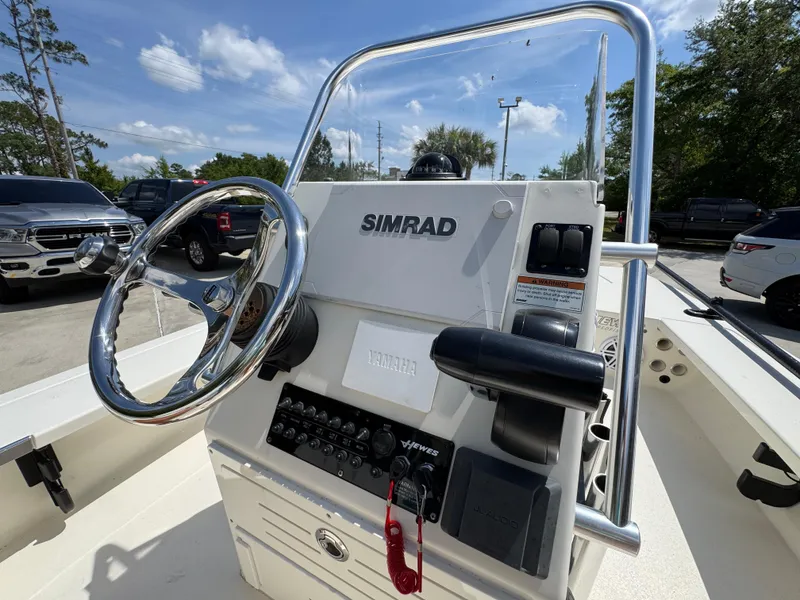 Slide: The Image of 2021 Hewes Redfisher 18 boat console with Simrad navigation system. - 32