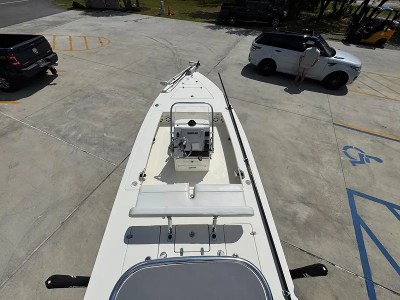 Slide: The Image of 2021 Hewes Redfisher 18 boat parked on concrete, viewed from above. - 34