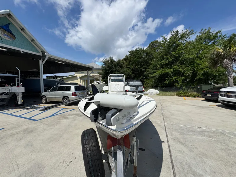 Slide: The Image of 2021 Hewes Redfisher 18 boat on trailer in sunny outdoor setting. - 6