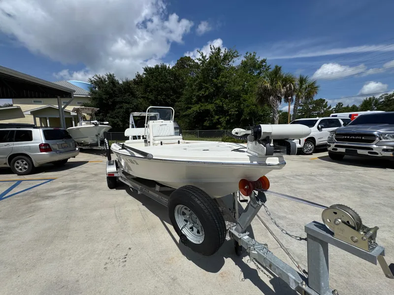 Slide: The Image of 2021 Hewes Redfisher 18 boat on trailer in parking lot, sunny day. - 7