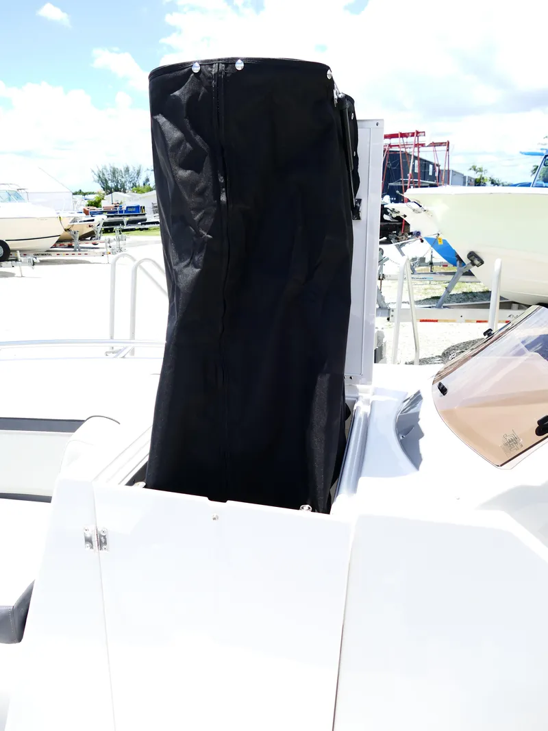 Slide: The Image of 2026 Starcraft SVX 231 OB DH boat with black cover on deck. - 25