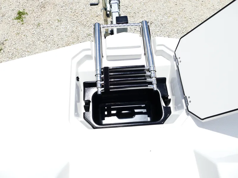 Slide: The Image of 2026 Starcraft SVX 231 OB DH boat ladder compartment, open with stainless steel ladder. - 34