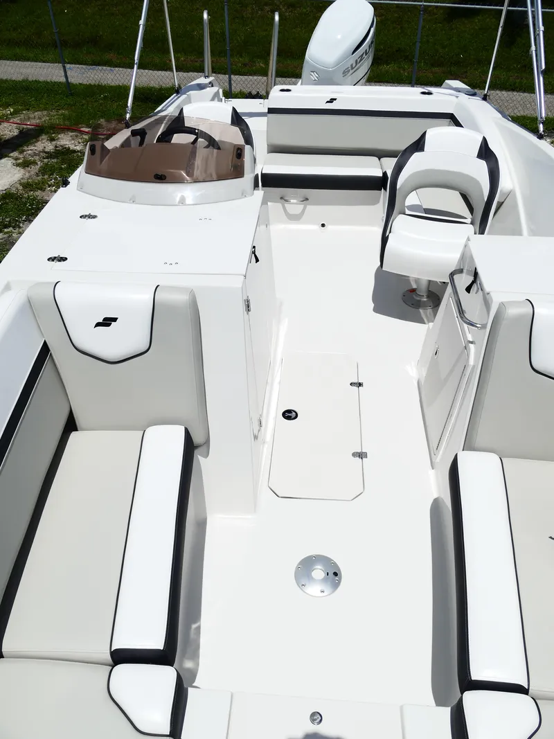 Slide: The Image of 2026 Starcraft SVX 231 OB DH boat interior with white seating and modern design. - 36