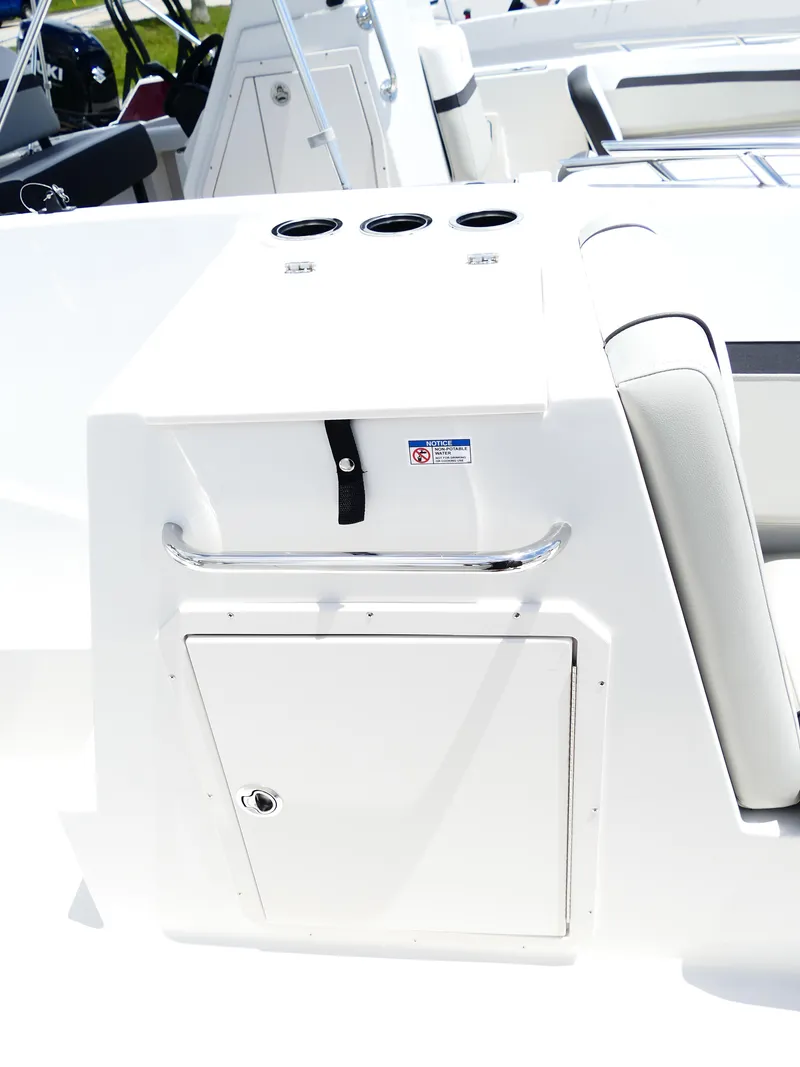 Slide: The Image of 2026 Starcraft SVX 231 OB DH boat interior with storage compartment and seating. - 37
