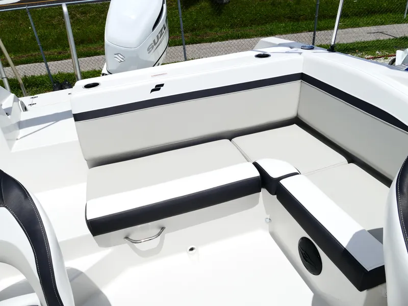 Slide: The Image of 2026 Starcraft SVX 231 OB DH boat interior with white and black seating. - 42