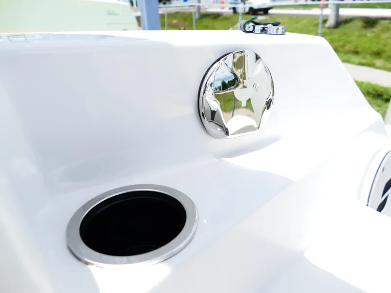 Slide: The Image of 2026 Starcraft SVX 231 OB DH boat detail with chrome accents and cup holder. - 46