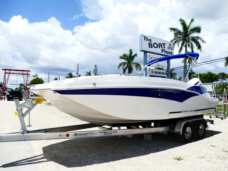 Slide: The Image of 2026 Starcraft SVX 231 OB DH boat on trailer at dealership, sunny day. - 5