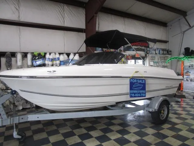 Slide: The Image of 2021 Bayliner VR4 Bowrider I/O for sale in showroom, on trailer, with canopy. - 13