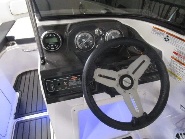 Slide: The Image of 2021 Bayliner VR4 Bowrider I/O dashboard with steering wheel and instrument panel. - 7