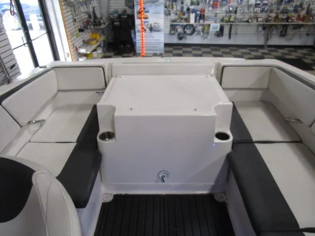 Slide: The Image of 2021 Bayliner VR4 Bowrider I/O interior with cushioned seating and cup holders. - 9