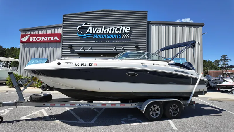 Slide: The Image of 2008 Hurricane 220 Sun Deck boat on trailer at Avalanche Motorsports. - 1