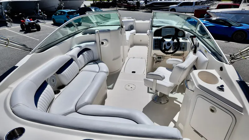 Slide: The Image of 2008 Hurricane 220 Sun Deck boat interior with seating and steering console. - 5