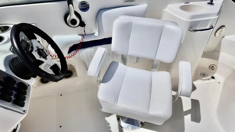 Slide: The Image of Captain's chair and helm of 2008 Hurricane 220 Sun Deck boat. - 7