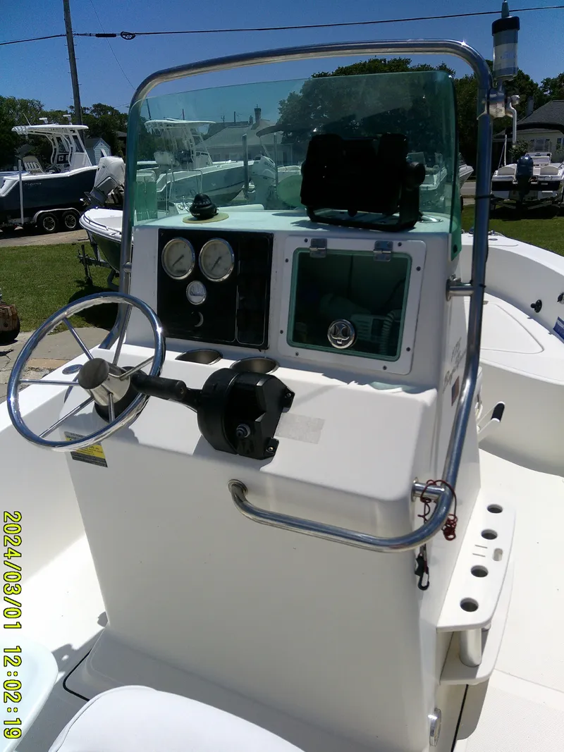Slide: The Image of 2006 Pioneer 175 Bay Sport boat console with steering wheel and gauges. - 17