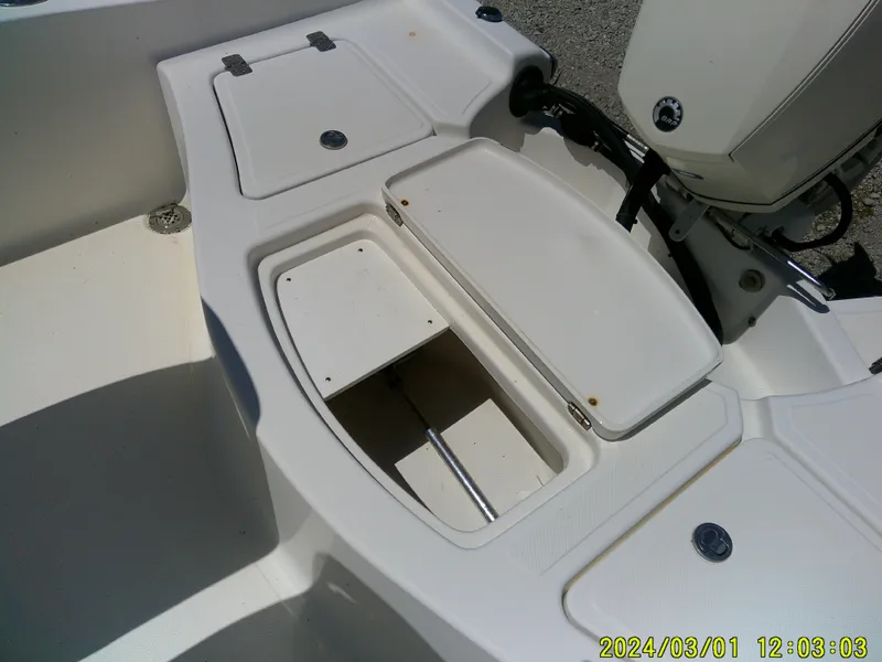 Slide: The Image of 2006 Pioneer 175 Bay Sport boat storage compartments and engine area. - 21