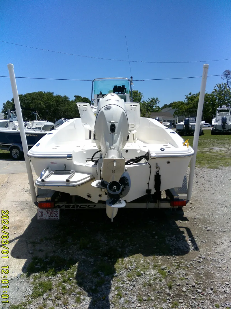 Slide: The Image of 2006 Pioneer 175 Bay Sport boat, rear view, parked outdoors on a sunny day. - 7
