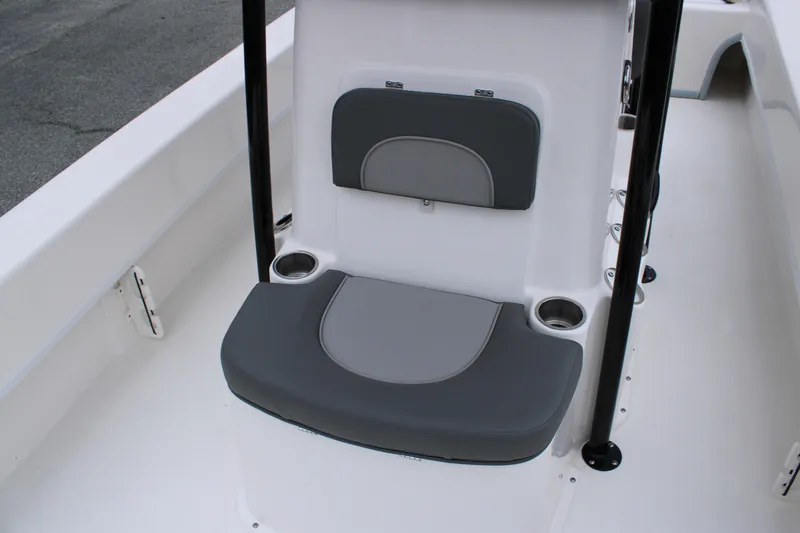 Slide: The Image of 2025 Sundance B22CCR boat seat with gray cushions and cup holders. - 11