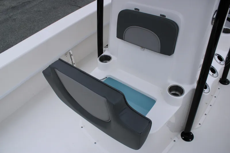 Slide: The Image of 2025 Sundance B22CCR boat seat with storage compartment and cup holders. - 12