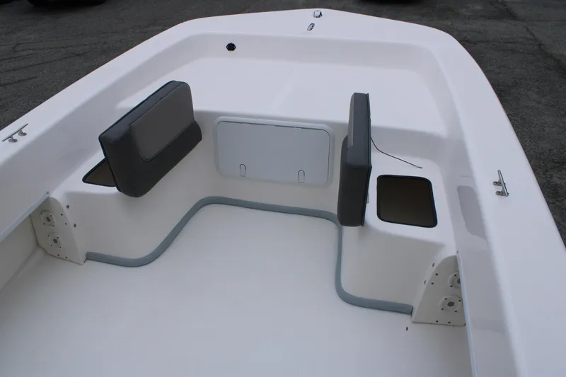 Slide: The Image of 2025 Sundance B22CCR boat interior with seating and storage compartments. - 14