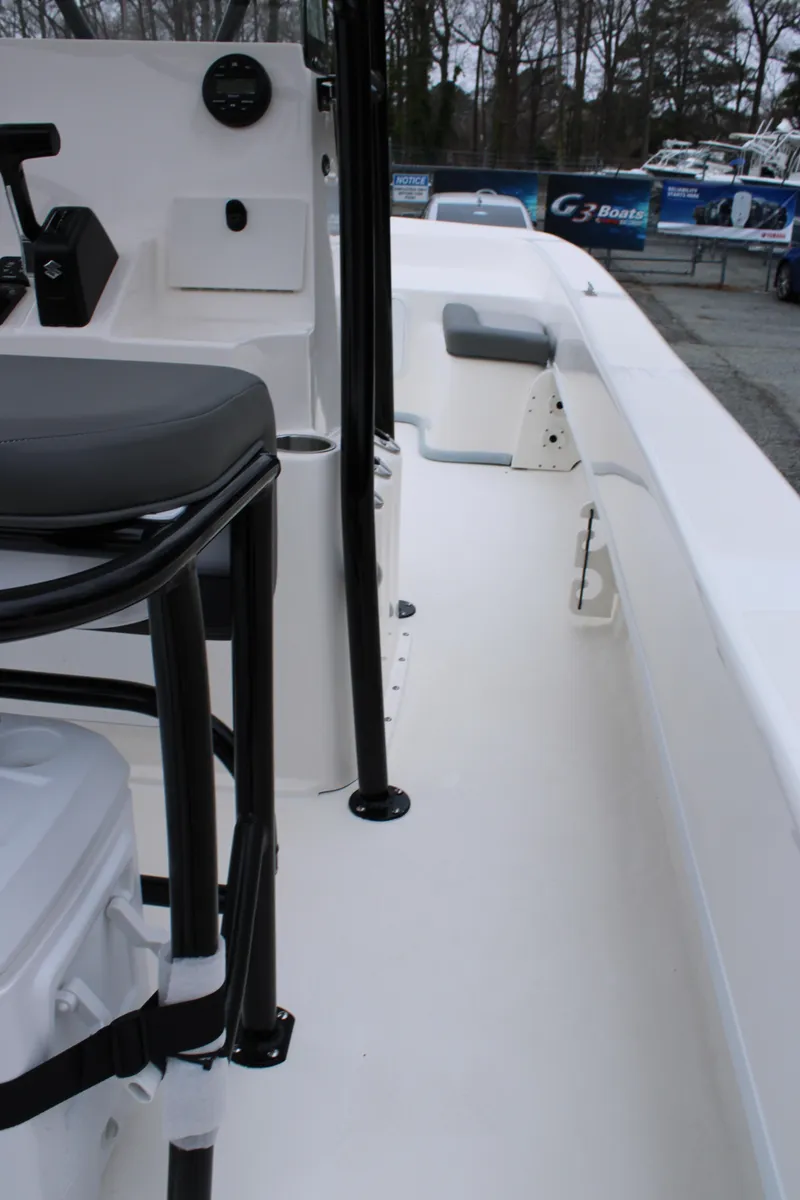 Slide: The Image of 2025 Sundance B22CCR boat interior with seating and console, showcasing sleek design and functionality. - 18