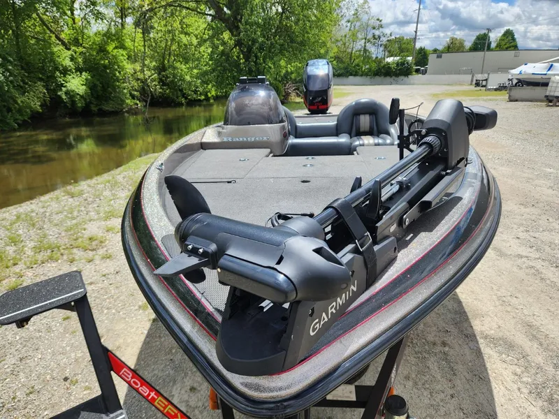 Slide: The Image of 2002 Ranger 185VS boat with Garmin equipment, parked near a river on a sunny day. - 10