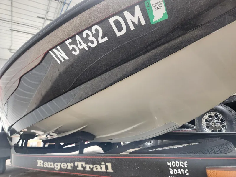 Slide: The Image of 2002 Ranger 185VS boat on trailer, registration IN 5432 DM, in a garage setting. - 17