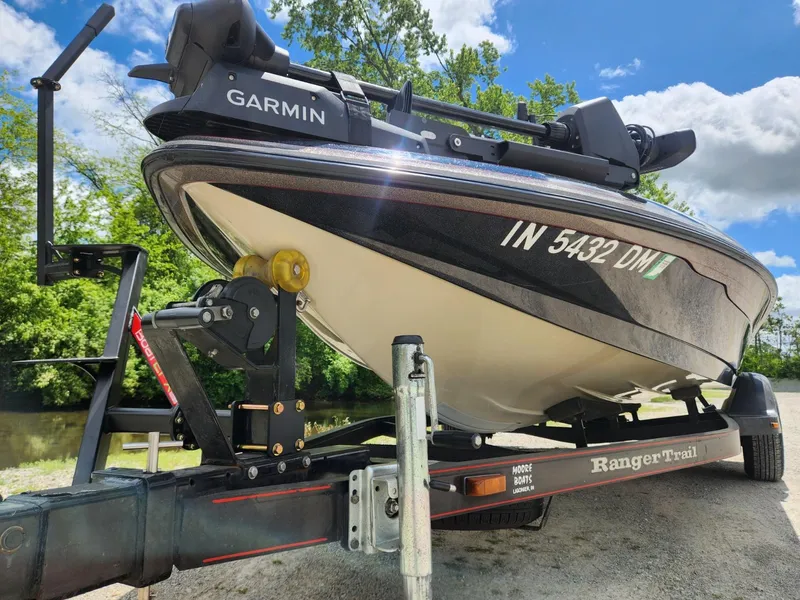 Slide: The Image of 2002 Ranger 185VS boat on trailer with Garmin equipment, parked near a river. - 9