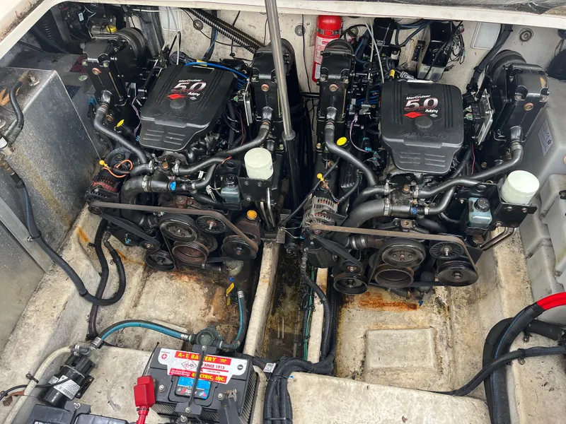 Slide: The Image of Twin engines in a 2005 Sea Ray 300 Sundancer boat engine compartment. - 24