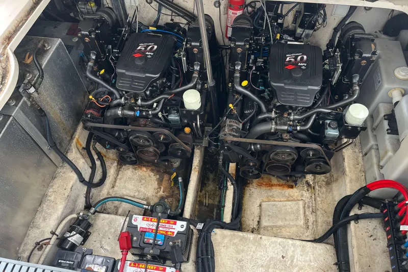 Slide: The Image of Engine compartment of a 2005 Sea Ray 300 Sundancer with dual engines. - 34