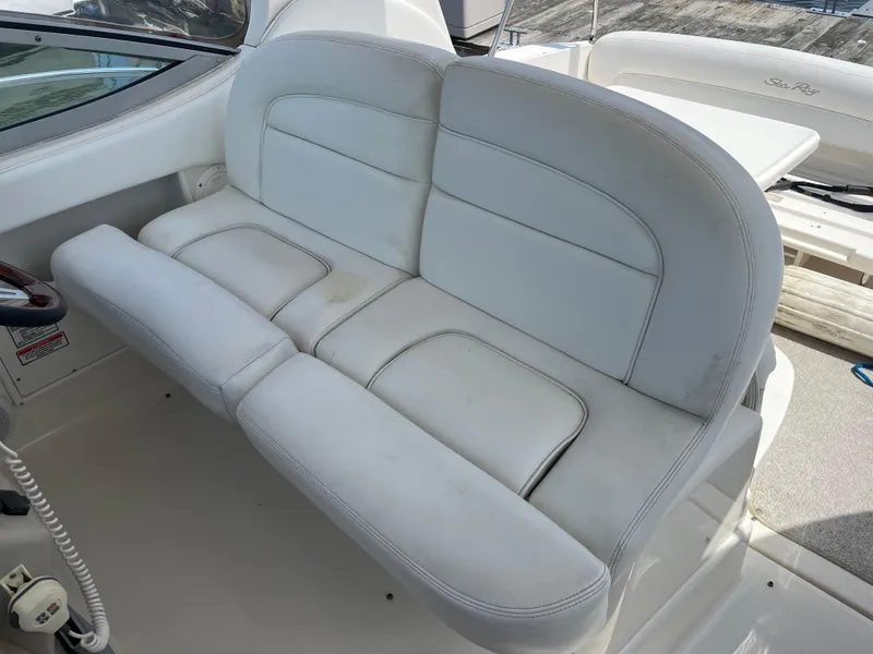 Slide: The Image of 2005 Sea Ray 300 Sundancer boat seating, white leather upholstery, cockpit view. - 6